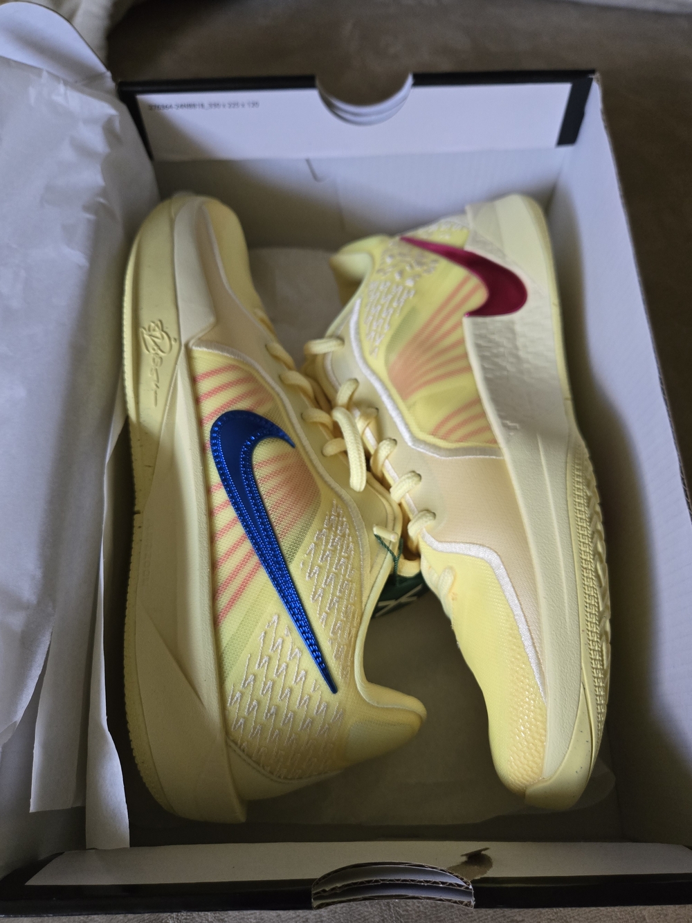 Nike Kids Yellow Low-Top Sneakers with Blue and Red Swoosh
